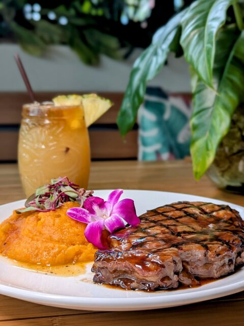 The Island Ribeye doesn’t rush — it arrives with intention. A 13oz Certified Angus Beef® ribeye, soaked in a pineapple ginger soy marinade that hits sweet, savory, and bold all at once, grilled just right and finished with whipped sweet potatoes and pistachios for that unexpected crunch. Pair it with one of our signature cocktails and suddenly it’s not just dinner — it’s the perfect combo. Island energy, steakhouse confidence, unforgettable flavor.

Available at all RUMBA locations. 🥩🍹✨