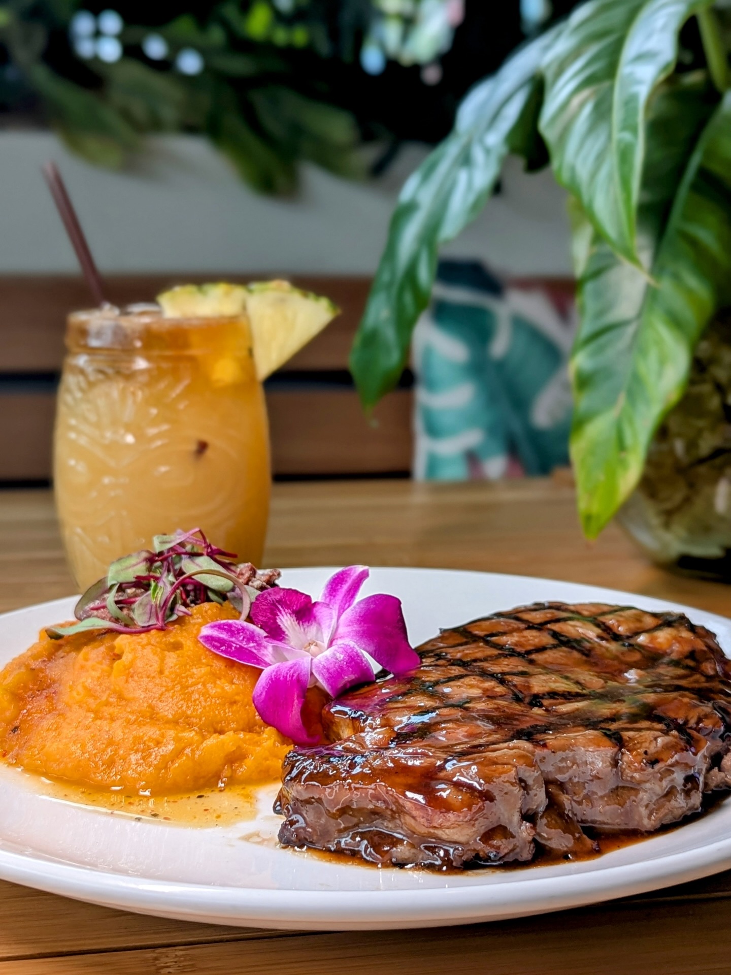 The Island Ribeye doesn’t rush — it arrives with intention. A 13oz Certified Angus Beef® ribeye, soaked in a pineapple ginger soy marinade that hits sweet, savory, and bold all at once, grilled just right and finished with whipped sweet potatoes and pistachios for that unexpected crunch. Pair it with one of our signature cocktails and suddenly it’s not just dinner — it’s the perfect combo. Island energy, steakhouse confidence, unforgettable flavor.

Available at all RUMBA locations. 🥩🍹✨