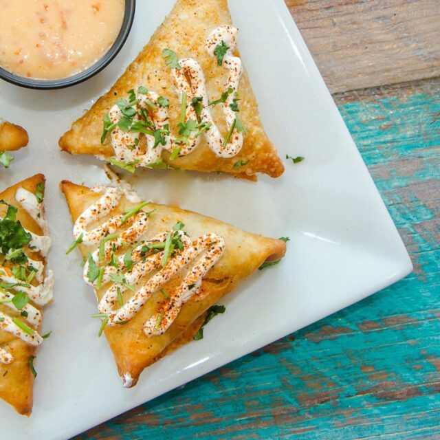 A close-up of one of our iconic starters. 👀🥟
Our Duck Empanadas bring duck, peppers, and spicy queso together inside crispy pastry, served with sweet chili horseradish sauce.
Crispy on the outside, packed with RUMBA flavor on the inside, and very easy to understand why they’ve become a favorite. 🌴
Available at RUMBA Hampton Bays + Patchogue.

#TasteRUMBA #DuckEmpanadas #RUMBAEats #HamptonBays #PatchogueEats